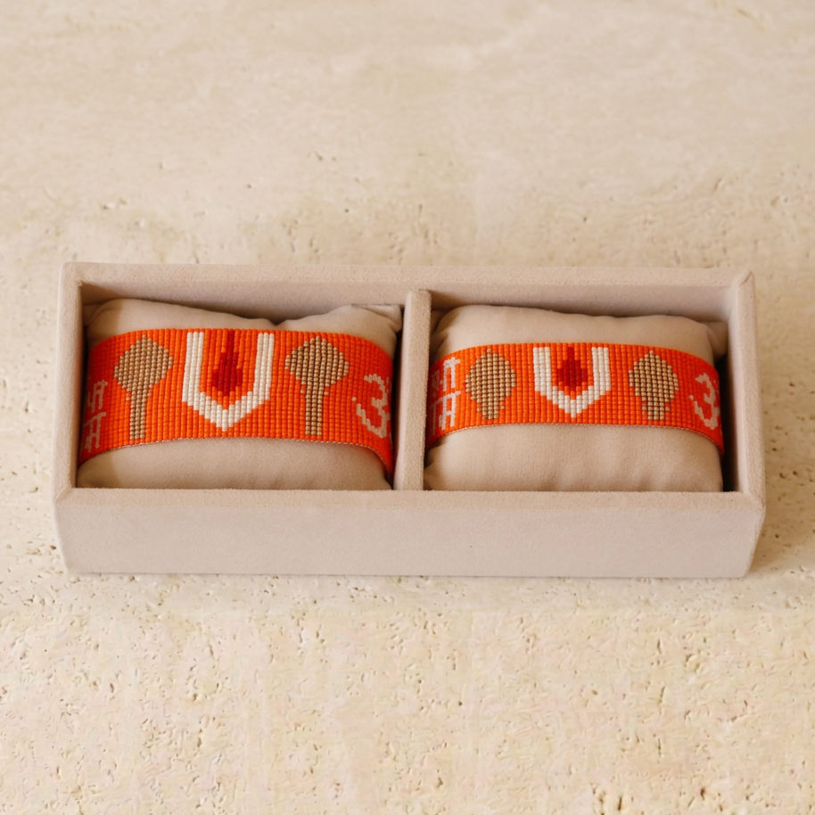 Orange two-piece set on a flat ivory surface